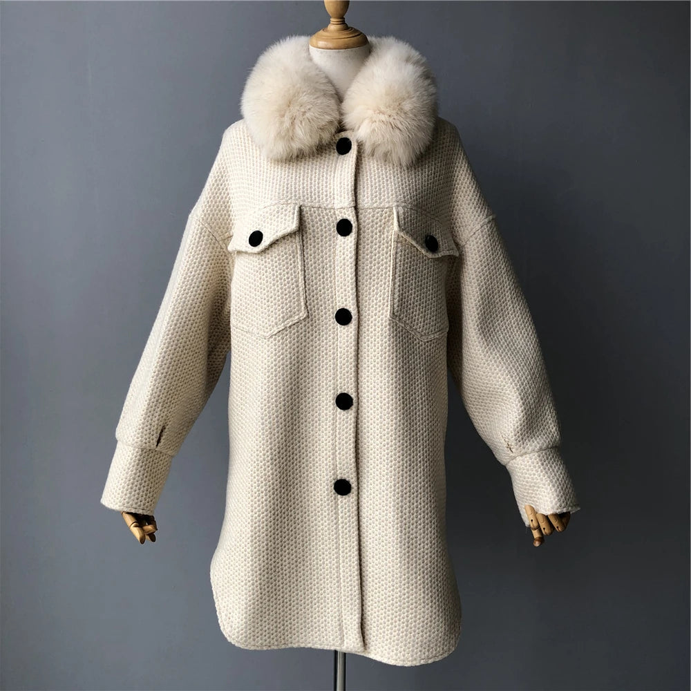 Beige coat with fur collar on a mannequin against a gray background