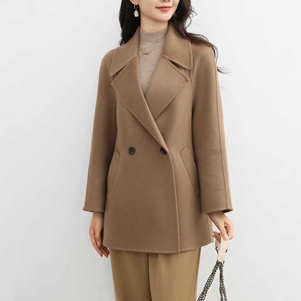 Woman wearing a brown coat on a white background