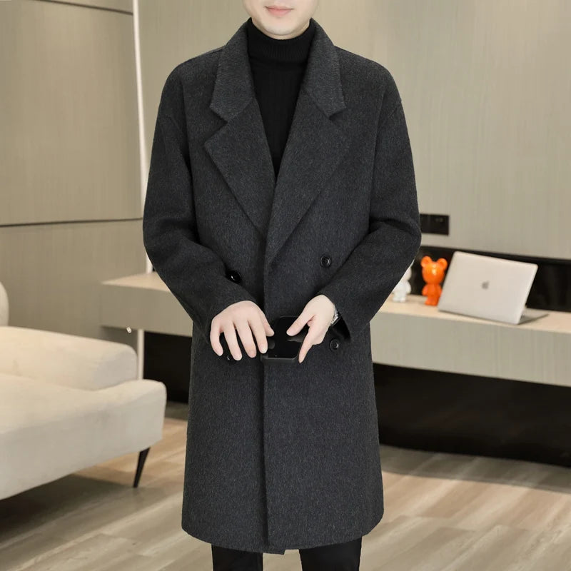 Person wearing a dark gray coat in an indoor setting