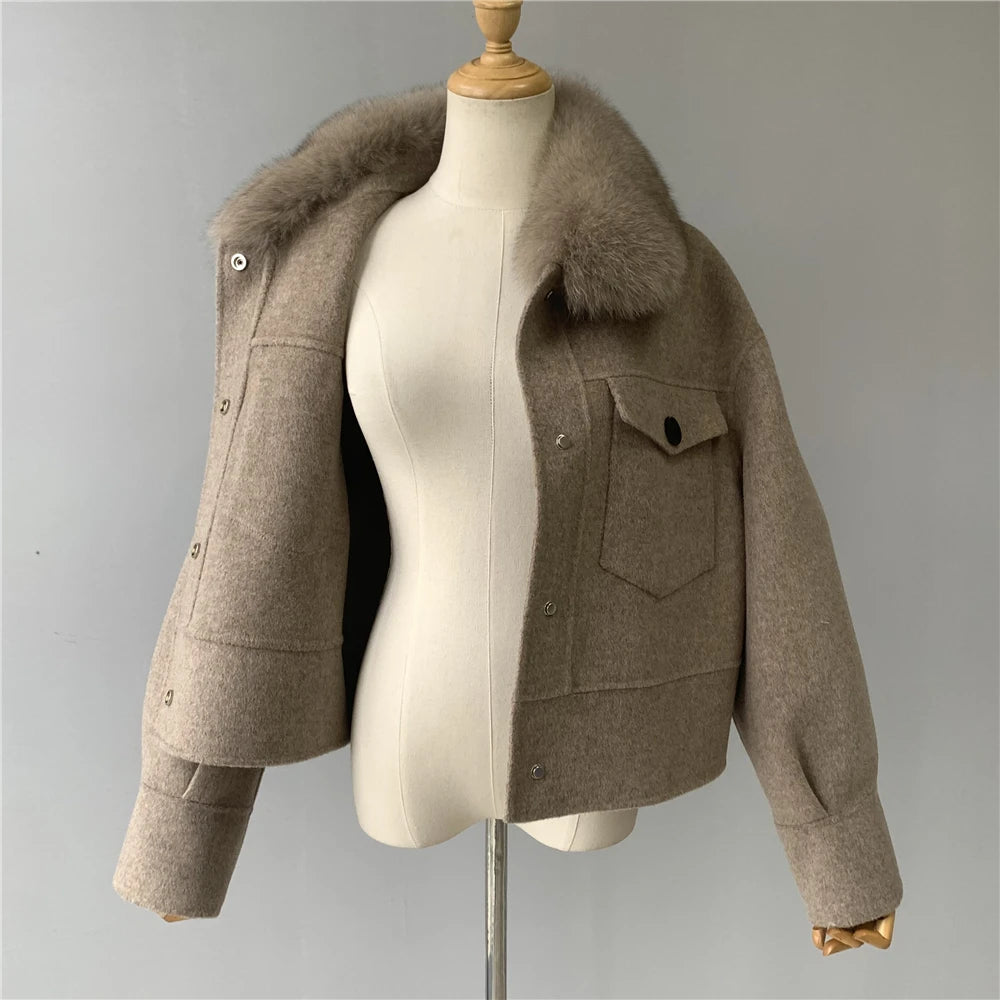 Brown jacket with fur collar on a mannequin against a gray background