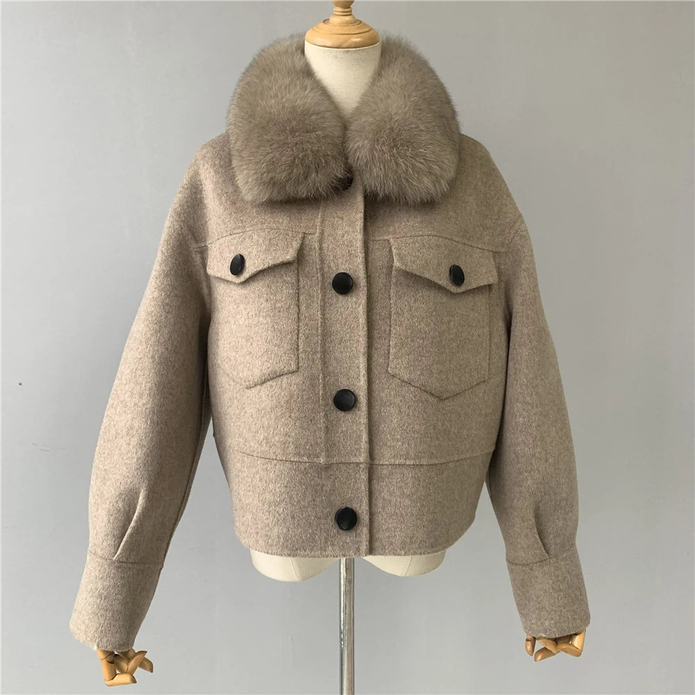 Beige jacket with fur collar on a mannequin against a gray background