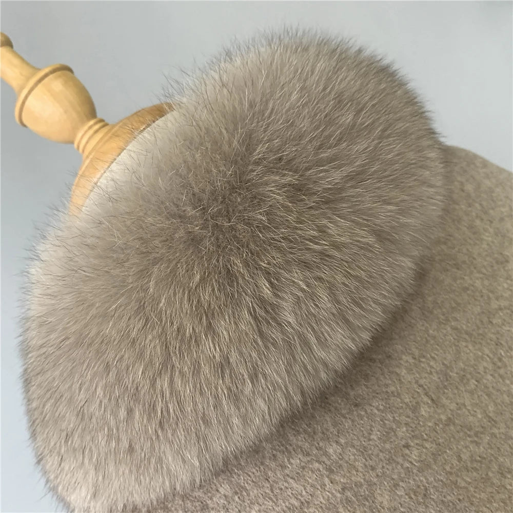 Close-up of a fur-lined garment with a wooden handle on a light gray background