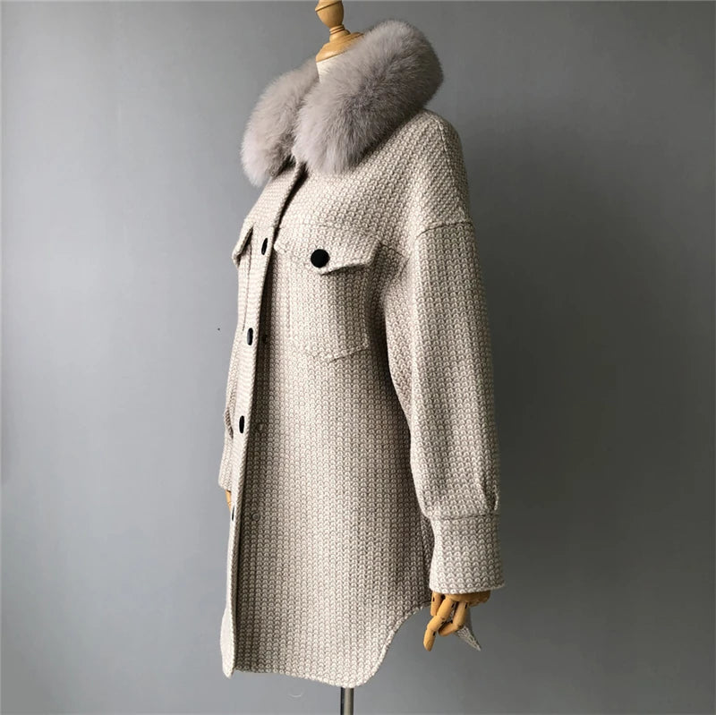 Beige coat with fur hood on a mannequin against a gray background