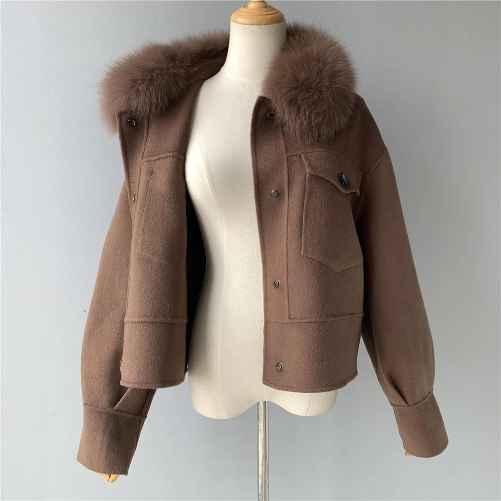 Brown jacket with fur collar on a mannequin against a gray background