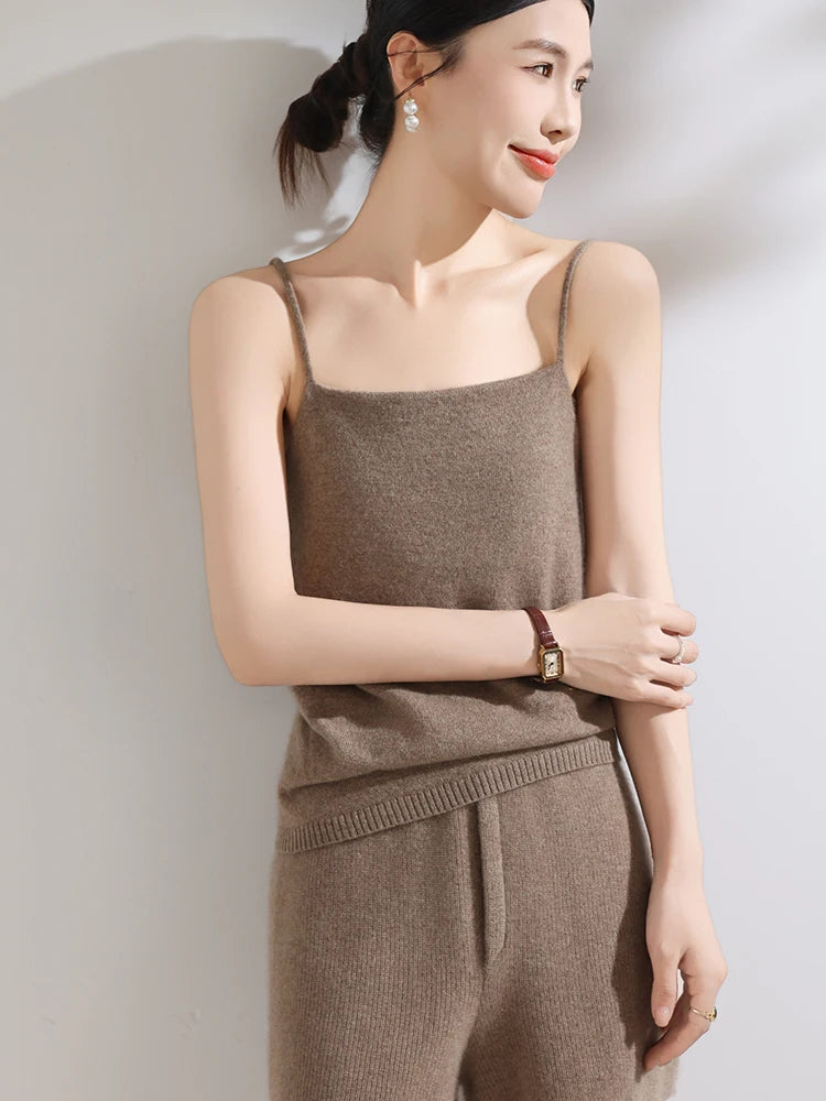 Woman wearing a brown knit outfit against a plain background