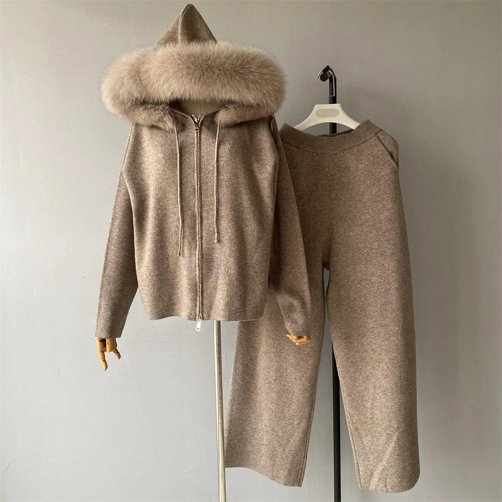 Brown hooded coat with fur trim on a mannequin against a plain background