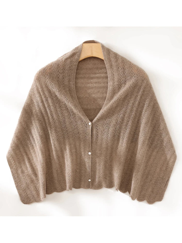Brown fuzzy cardigan on a wooden hanger against a white background