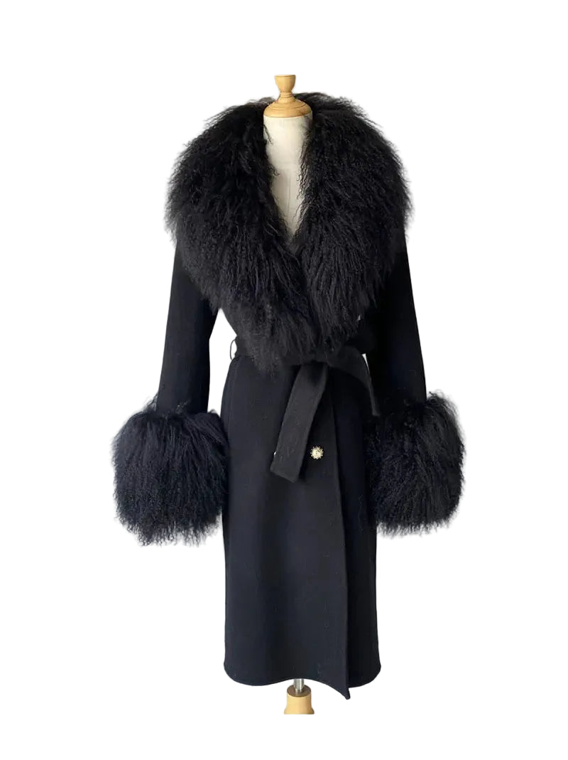 Black coat with fur accents on a mannequin against a plain background