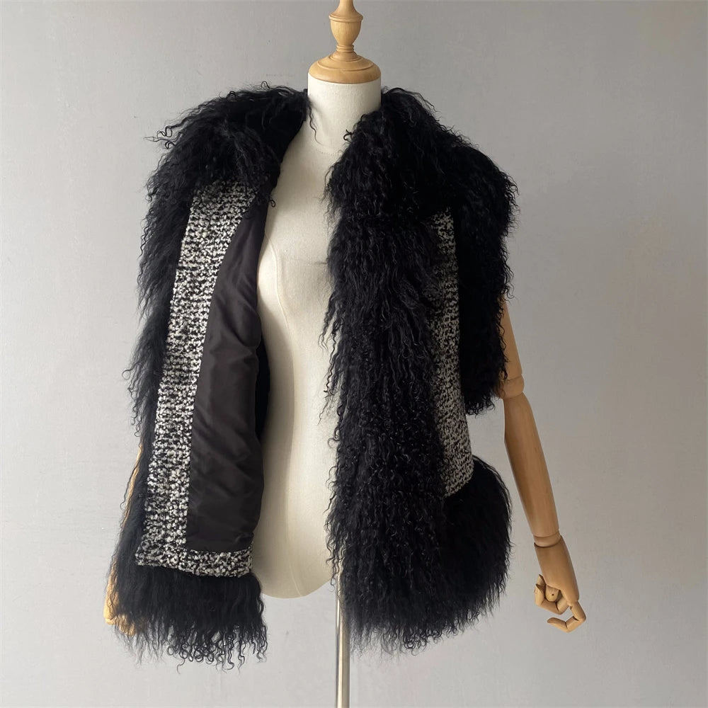 Black fur vest with a patterned interior on a mannequin against a plain background