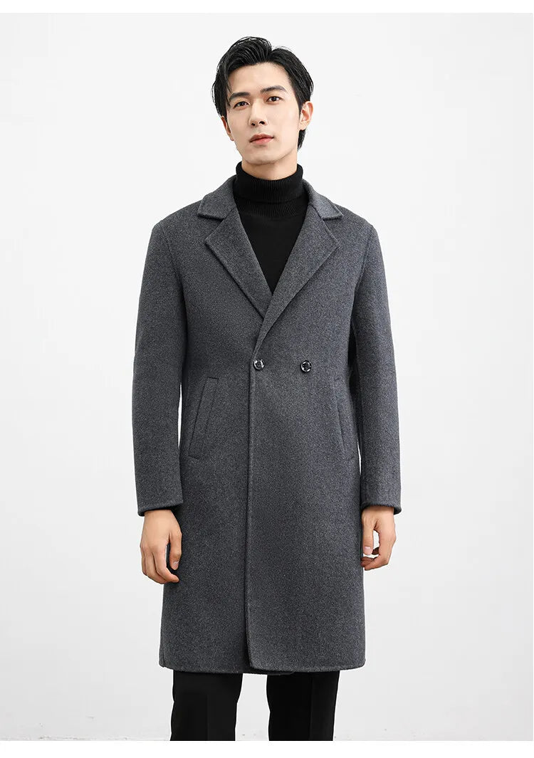 Man wearing a gray coat on a white background