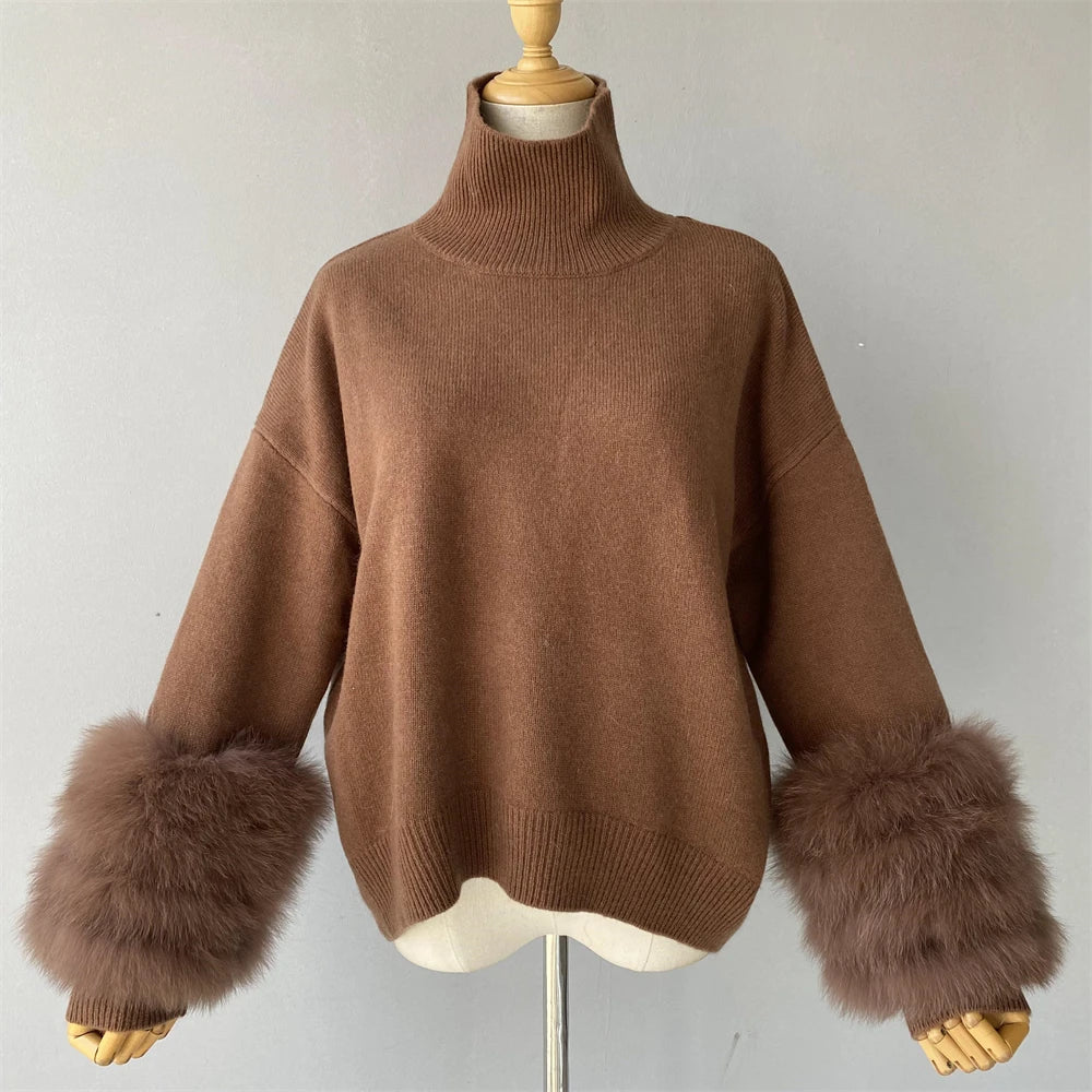 Brown sweater with fur cuffs on a mannequin against a plain background