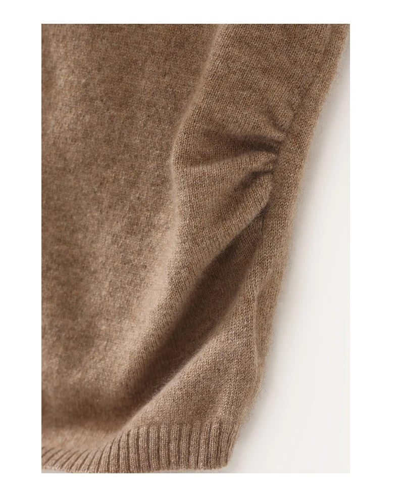 Close-up of a brown knitted sweater sleeve on a white background