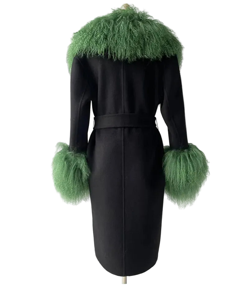 Black coat with green feathered trim on a gray background