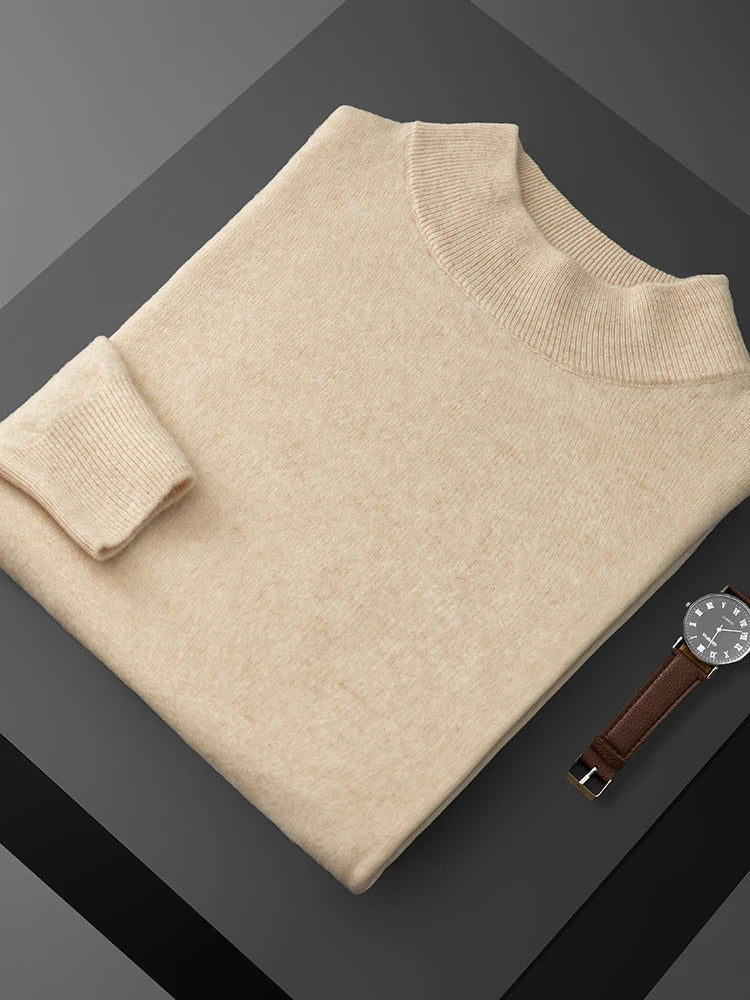 Beige sweater and watch on a dark gray background