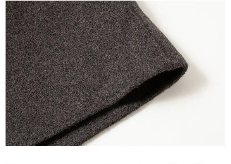 Close-up of dark gray fabric on a white background with 'Details from Mohe Men's Wear' text.