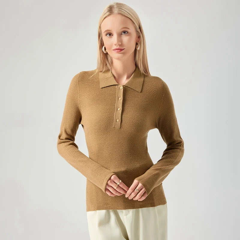 Woman wearing a brown long-sleeve polo shirt against a light gray background