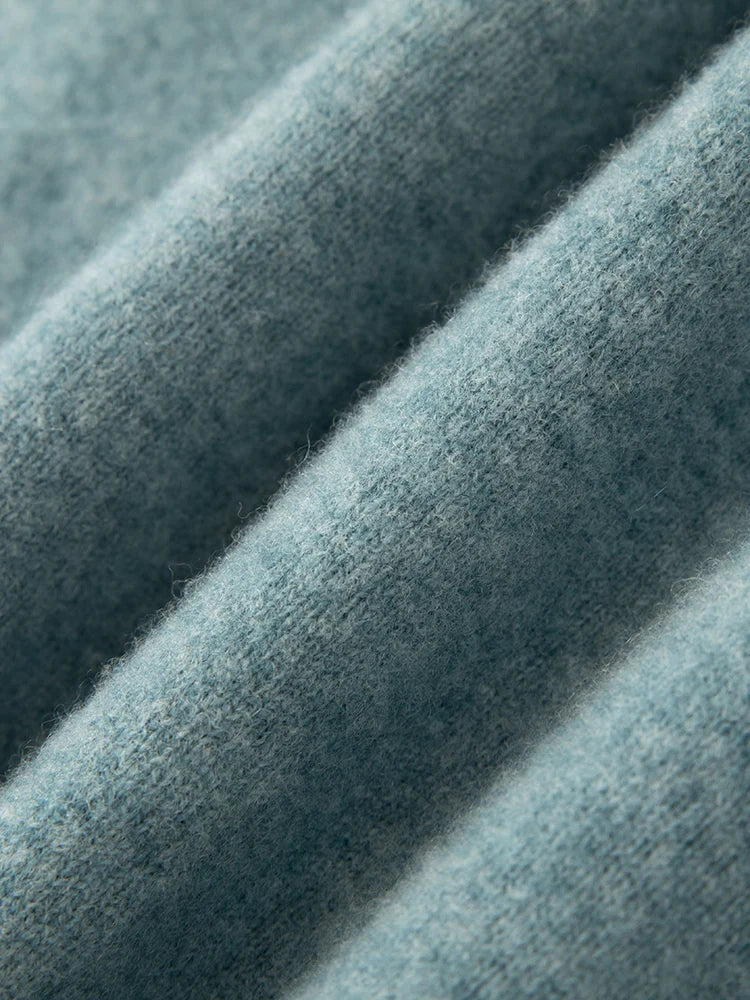 Close-up of textured blue fabric with a soft, plush surface.
