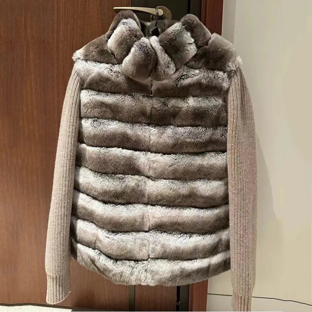Fur vest with knit sleeves on a hanger against a wooden door background