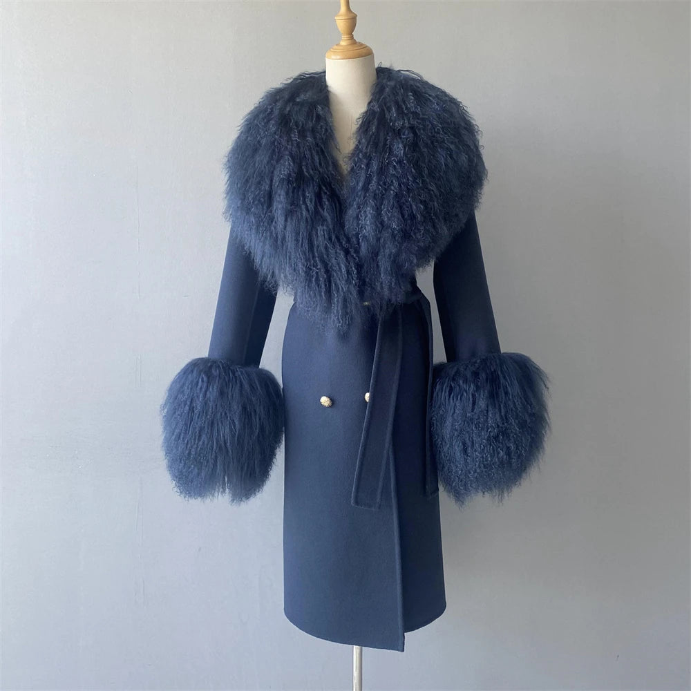 Blue coat with fur accents on a mannequin against a plain background