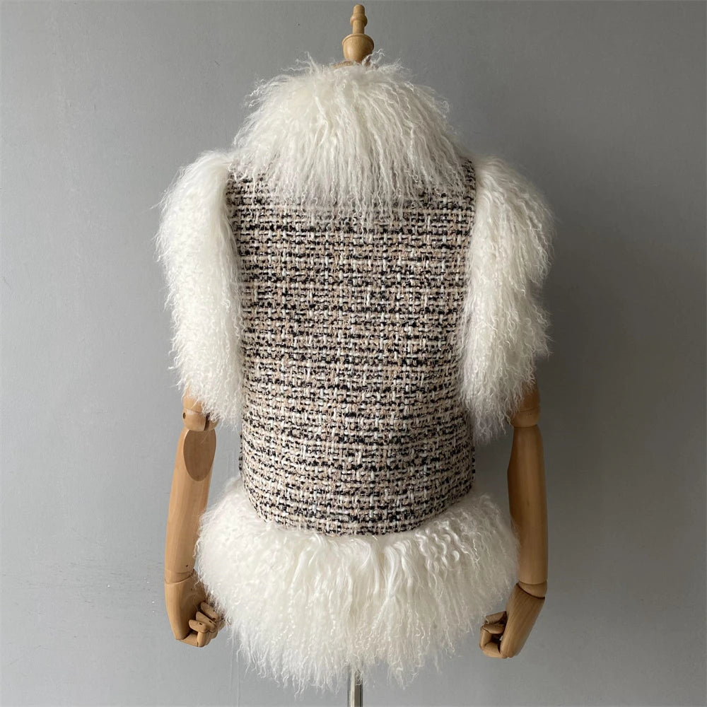 Mannequin wearing a textured vest with white fluffy sleeves and skirt against a gray background