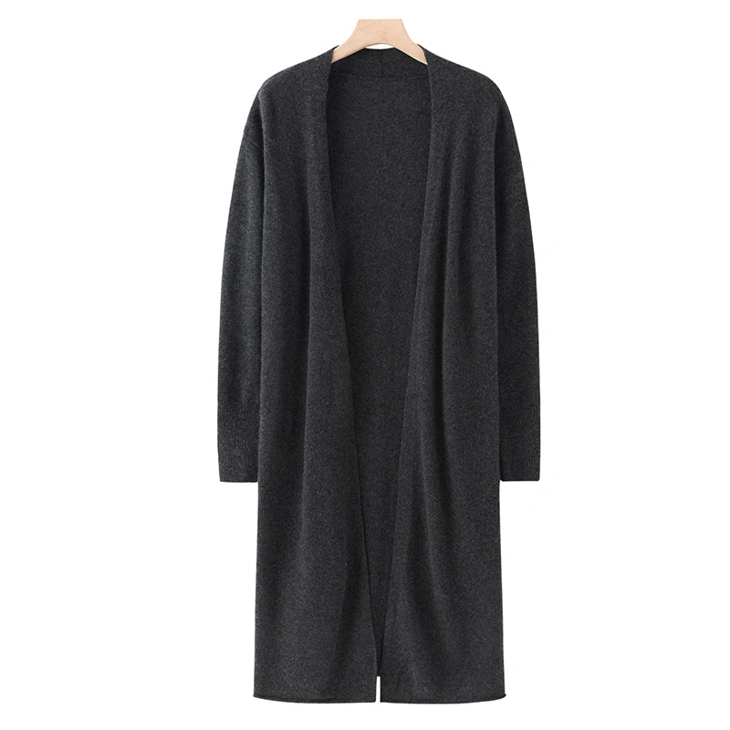 Dark gray cardigan on a hanger against a white background