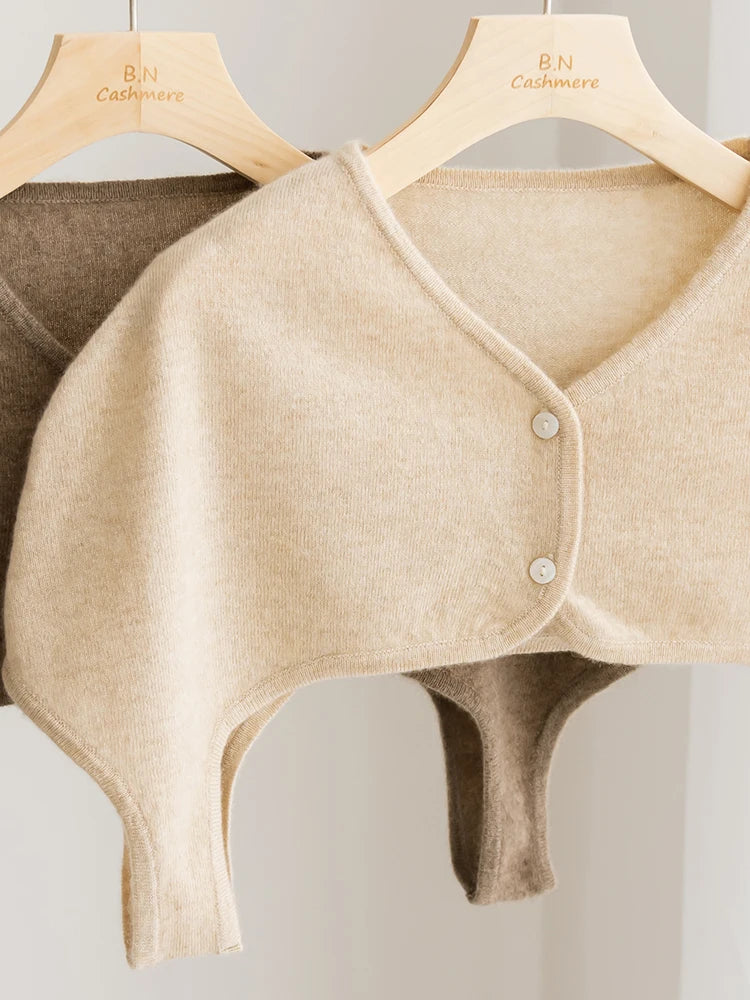 Beige cashmere shrug on a hanger with 'B.N Cashmere' branding.
