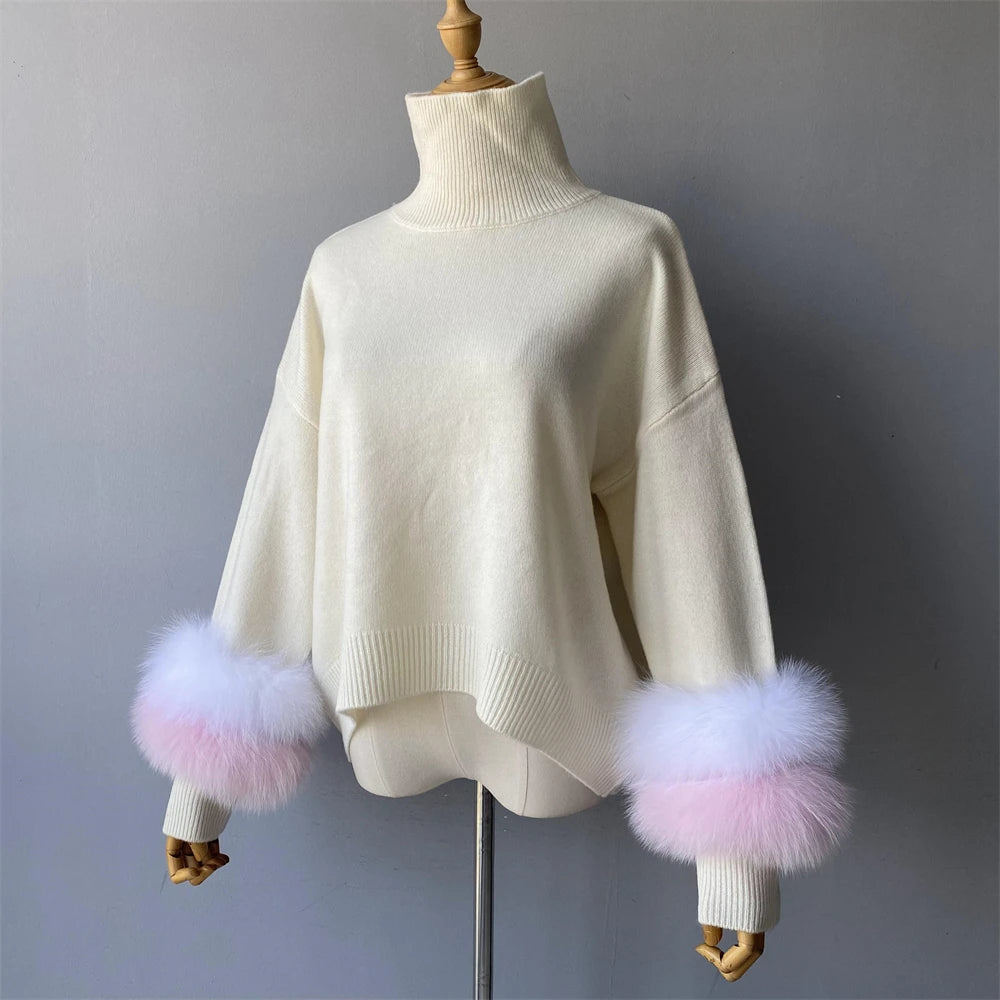 White sweater with pink and purple fur cuffs on a mannequin against a gray background