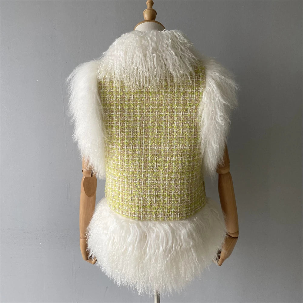 Mannequin wearing a green textured top with white fluffy sleeves and bottom on a gray background