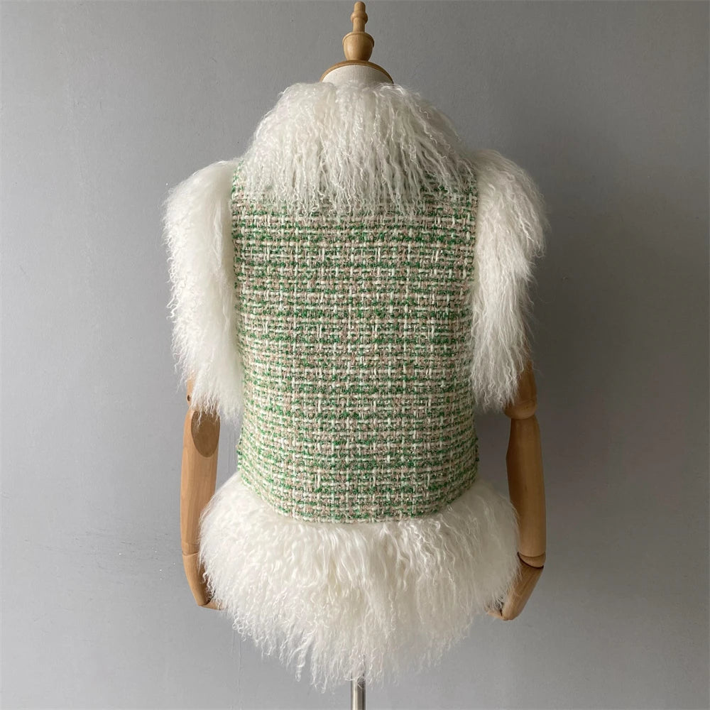 Mannequin wearing a green tweed vest with white fur trim against a gray background