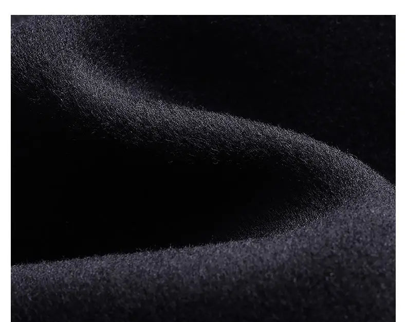 Close-up of dark fabric texture with a black background