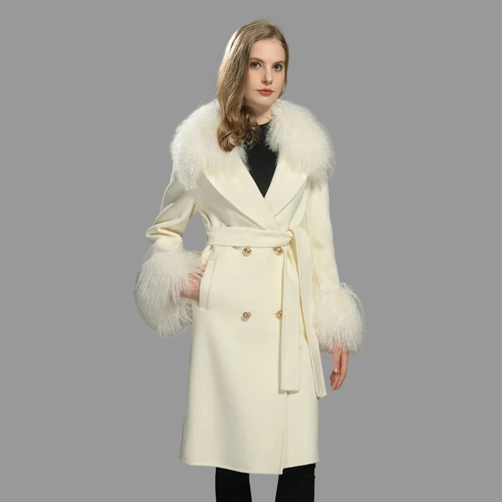 Woman wearing a white coat with fur trim on a gray background