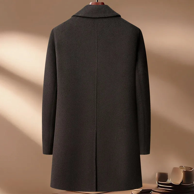 Dark gray coat on a mannequin against a beige background