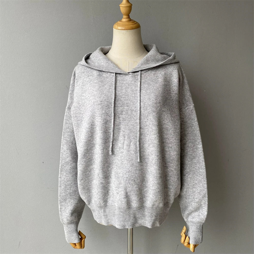 Gray hoodie on a mannequin against a gray background