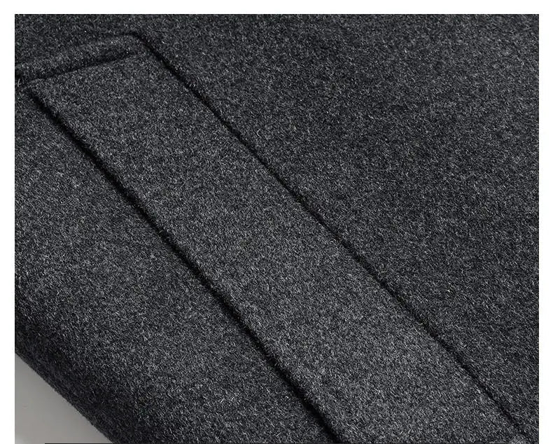 Close-up of dark gray fabric with a pocket detail