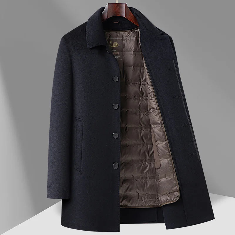 Black coat with quilted lining on a gray background