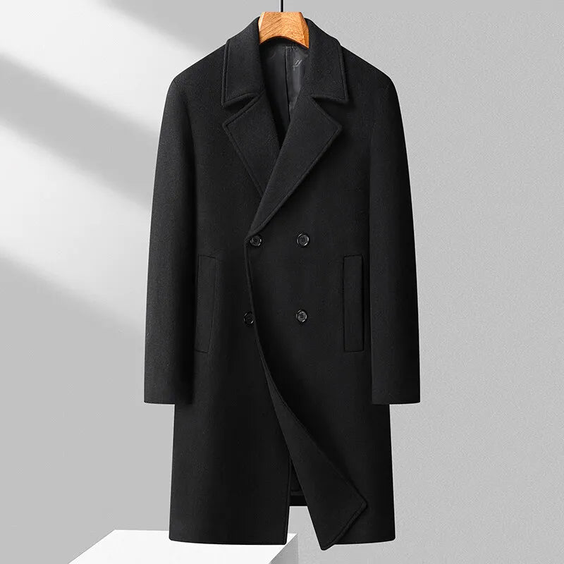 Black coat on a hanger against a light gray background