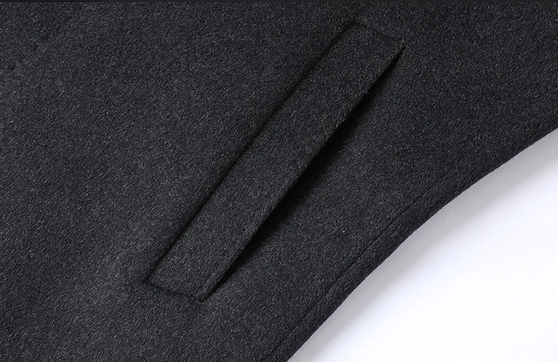 Close-up of a black fabric pocket with stitching details on a white background