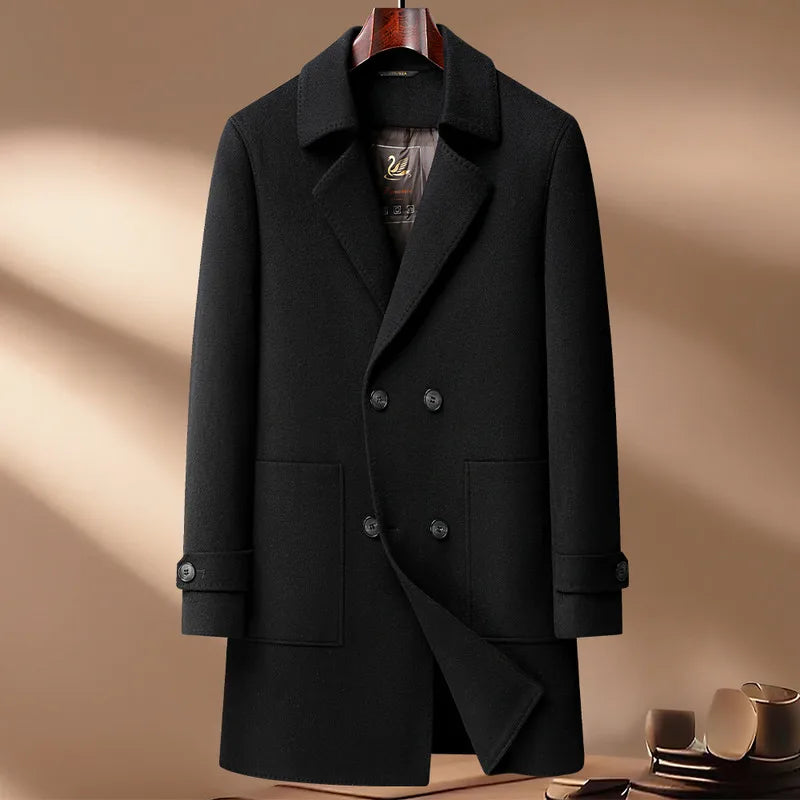 Black coat on a hanger against a beige background