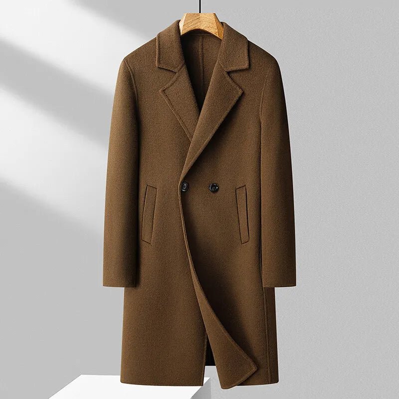 Brown coat on a hanger against a light gray background