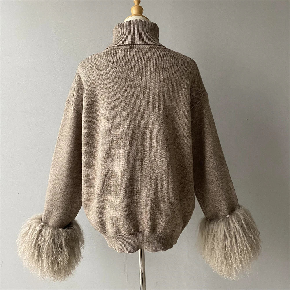 Brown sweater with fluffy cuffs on a mannequin against a plain background