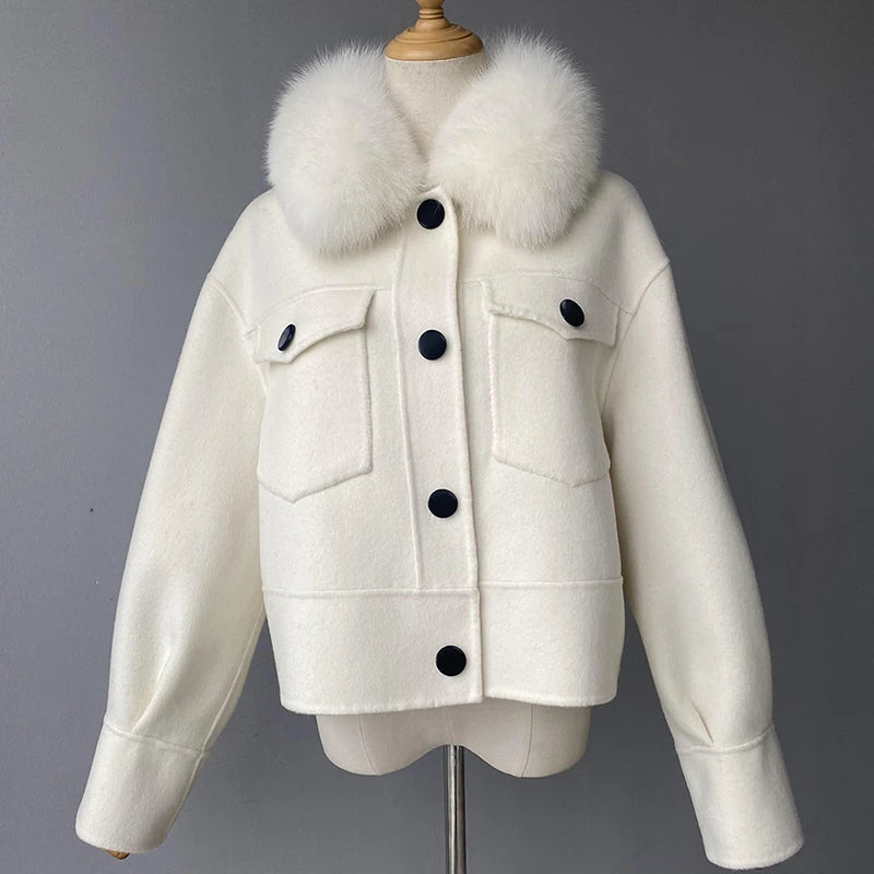 White jacket with fur collar on a mannequin against a gray background