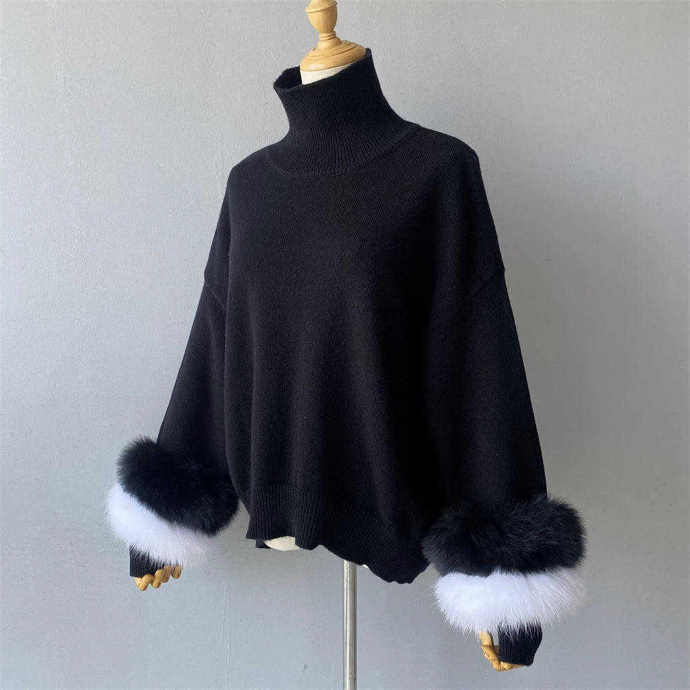 Black sweater with fur cuffs on a mannequin against a plain background