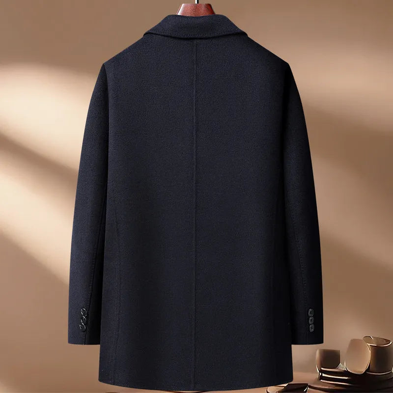 Dark blue coat on a mannequin against a beige background