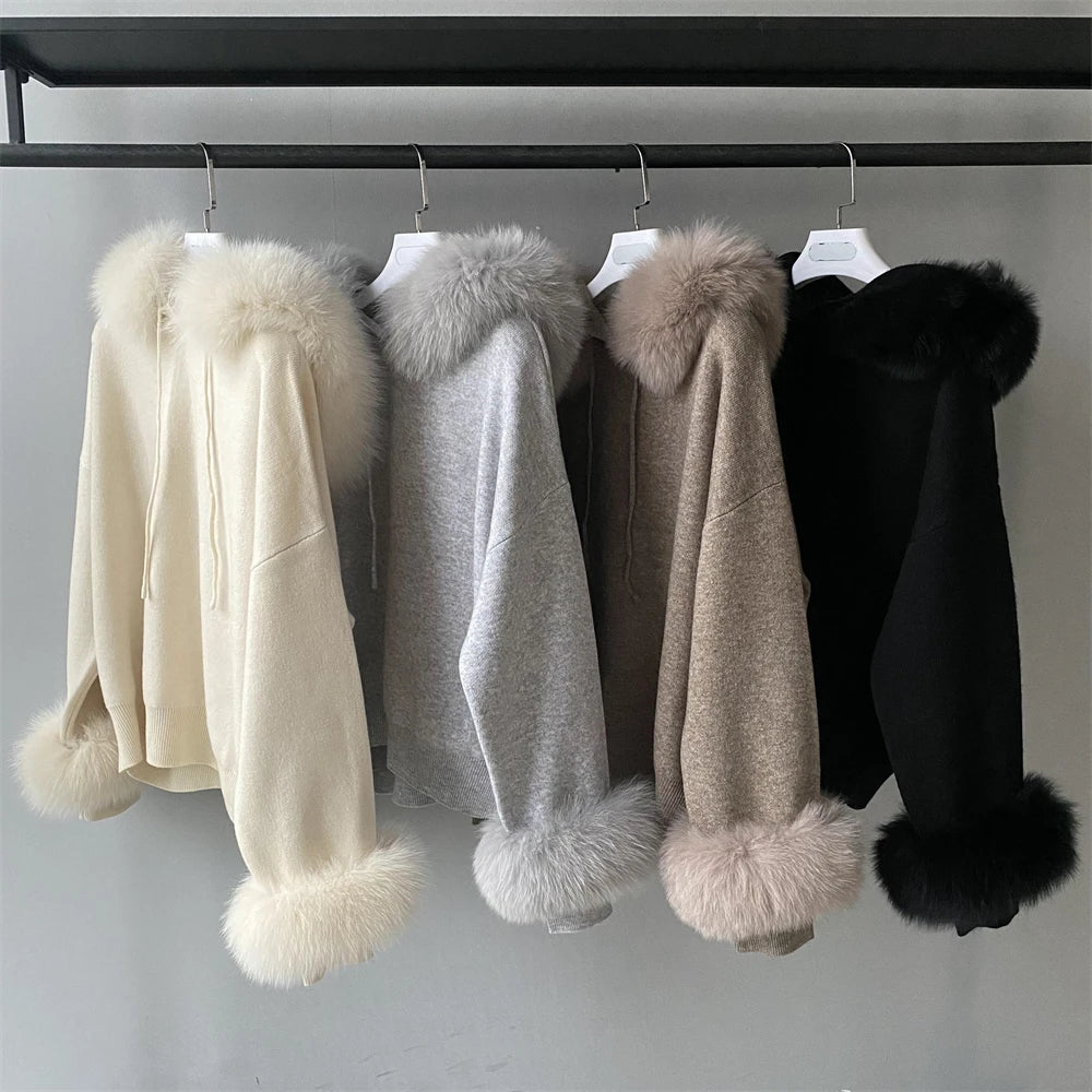Four fur-trimmed coats in beige, gray, brown, and black hanging on a rack.