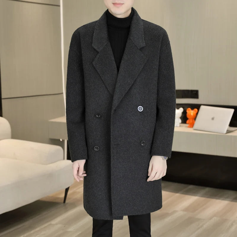 Person wearing a dark gray coat in an indoor setting