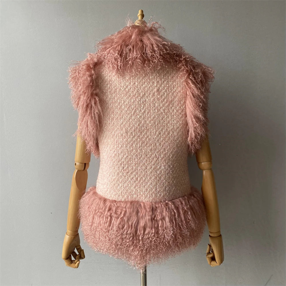 Mannequin wearing a pink textured outfit with fluffy details on a plain background