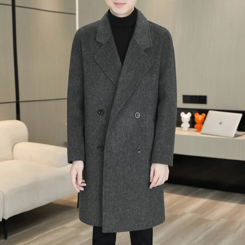 Person wearing a gray coat in an indoor setting