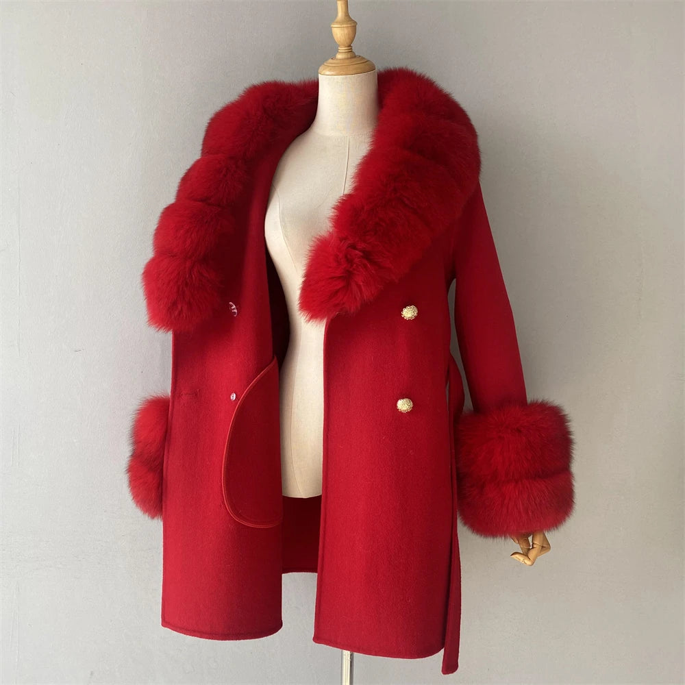 Red coat with fur trim on a mannequin against a plain background