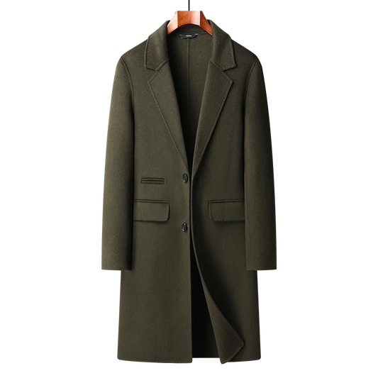 Green coat on a hanger against a white background