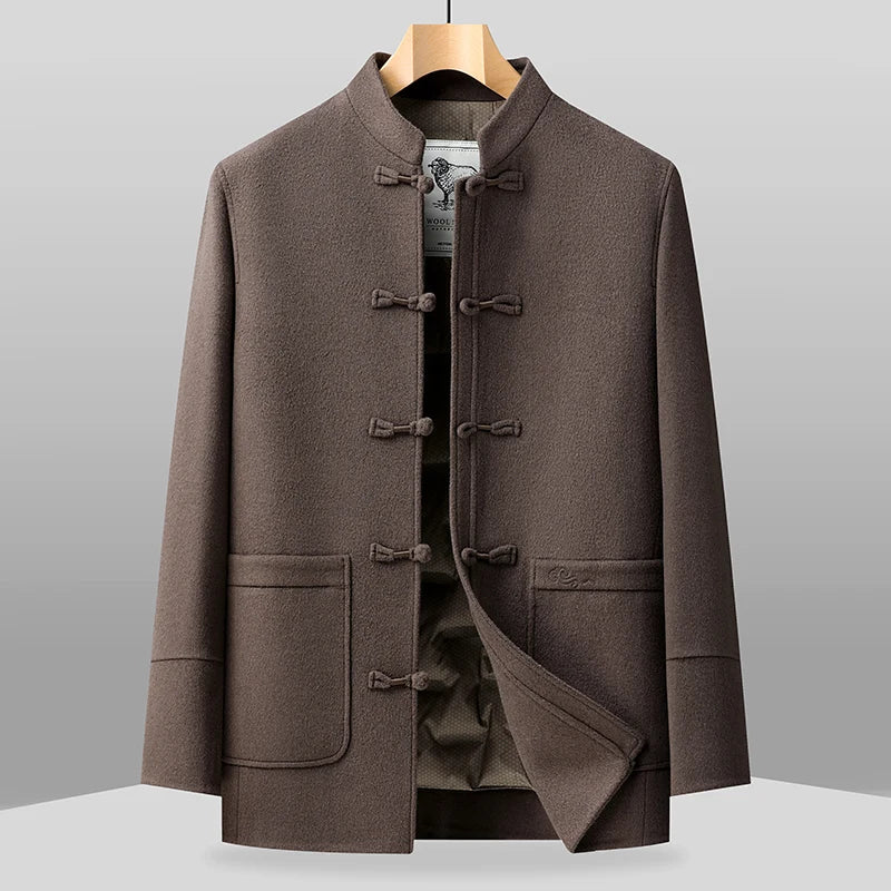 Brown coat on a hanger against a gray background